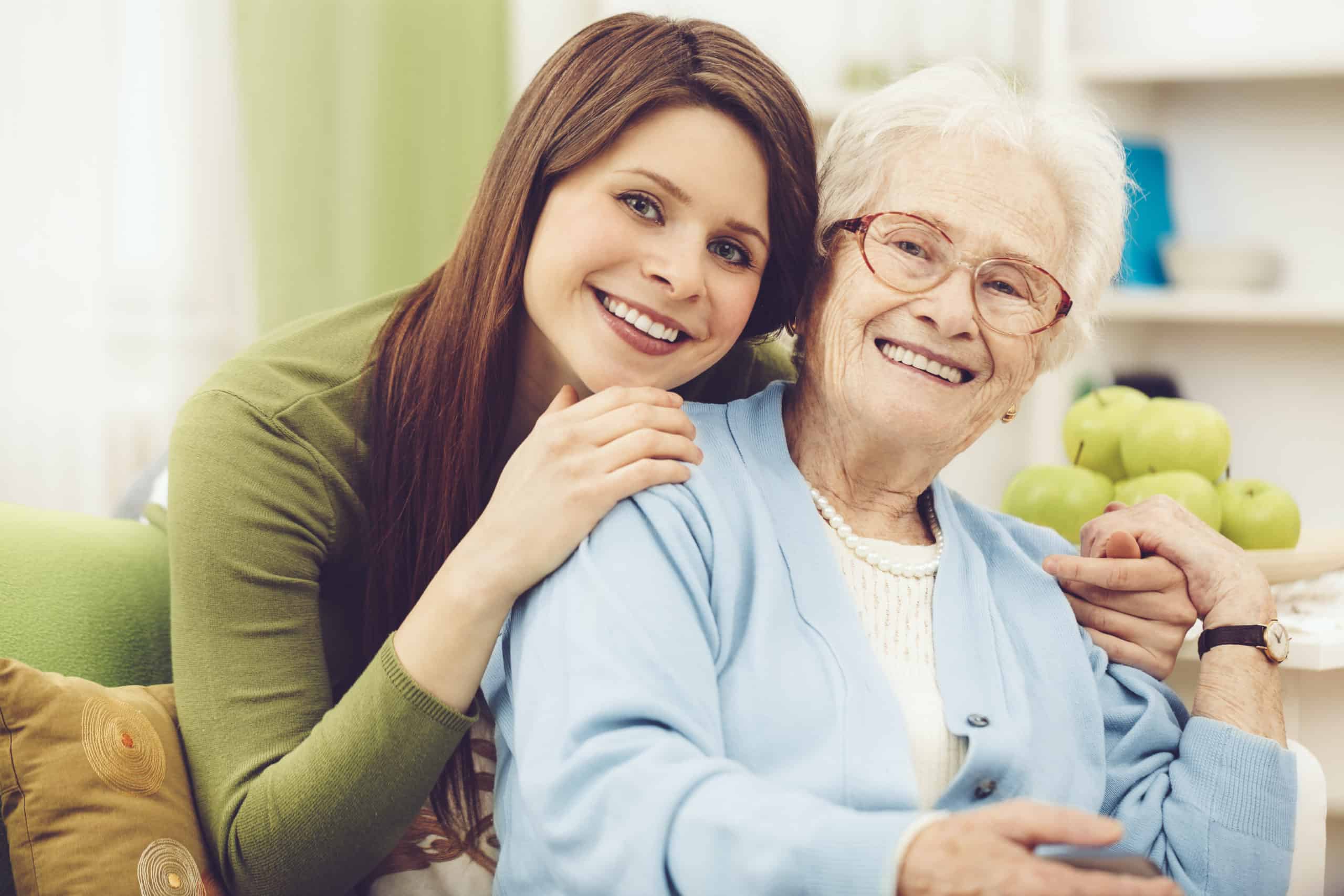 Younger woman embracing older woman